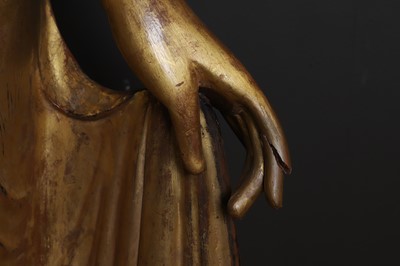 Lot 637 - A very large lacquered and giltwood figure of the standing Buddha