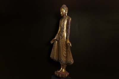 Lot 637 - A very large lacquered and giltwood figure of the standing Buddha