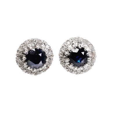 Lot 1154 - A pair of sapphire and diamond stud earrings