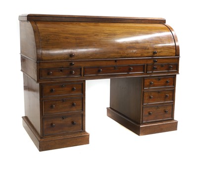 Lot 635 - A mahogany cylinder bureau desk