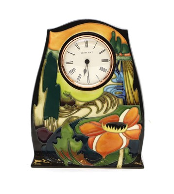 Lot 186 - A Moorcroft pottery 'Ryden Fields' pattern timepiece