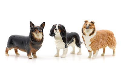 Lot 256 - Three Beswick dogs, a corgi 'Black Prince' a King Charles spaniel, and a Collie