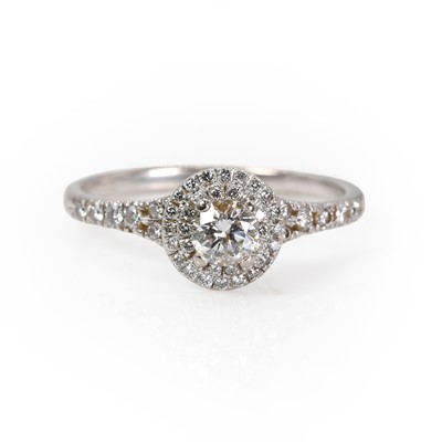 Lot 1098 - An 18ct white gold diamond ring