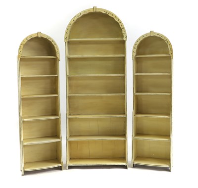 Lot 734 - A set of three painted dome top waterfall bookcases