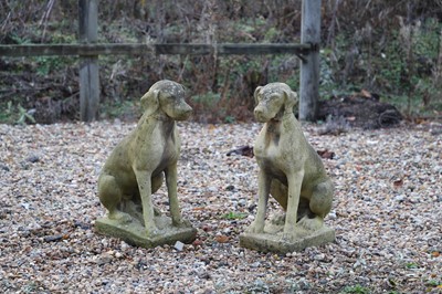 Lot 762 - A pair of reconstituted stone dogs