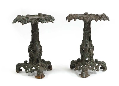 Lot 712 - A pair of cast iron tables