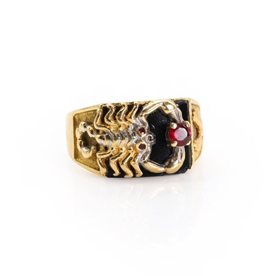 Lot 1176 - An onyx and ruby set scorpion ring