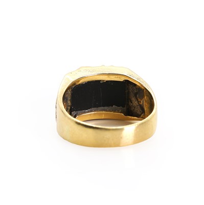 Lot 1176 - An onyx and ruby set scorpion ring