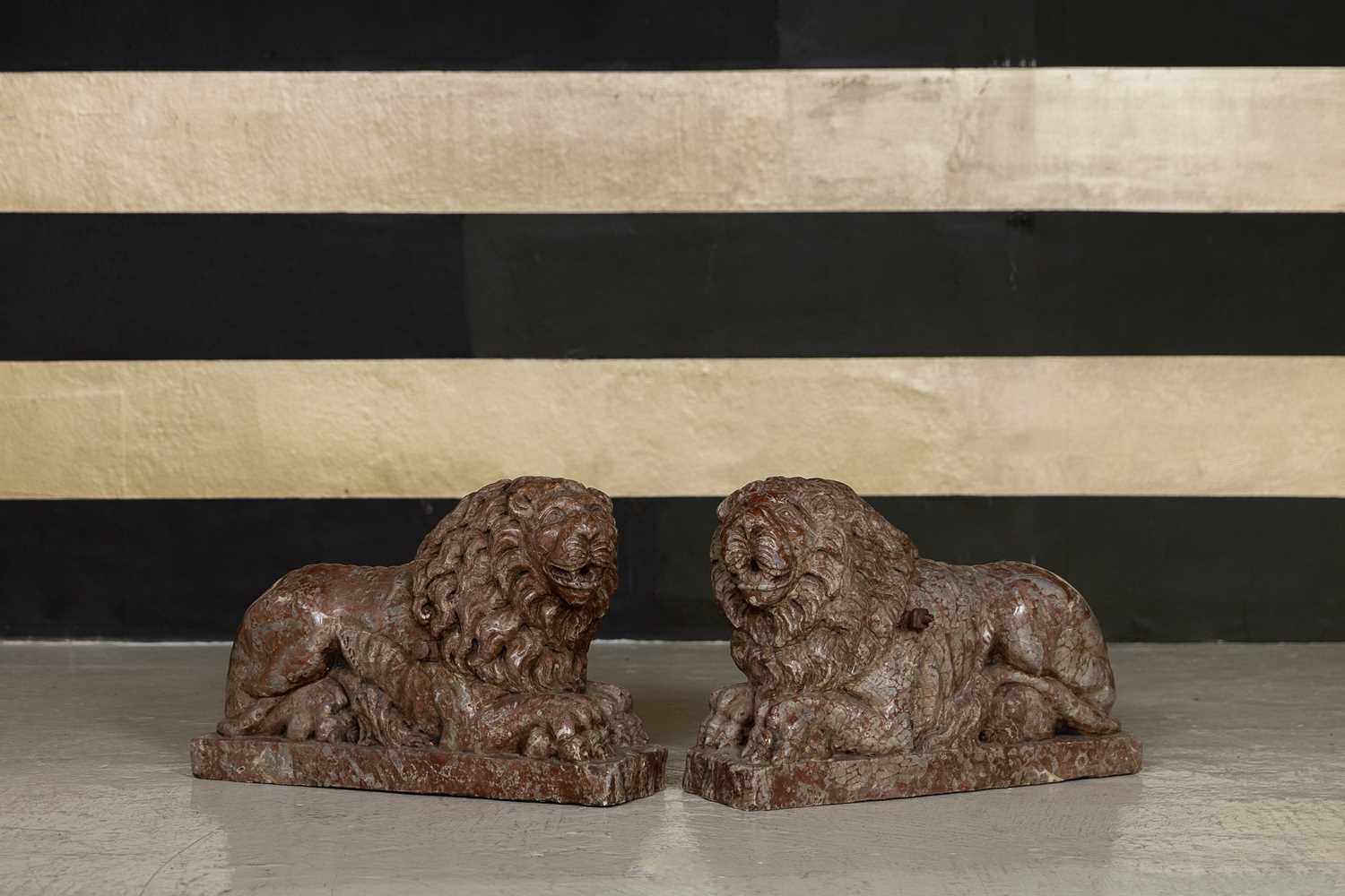 Lot A pair Renaissance-style carved rouge marble lions