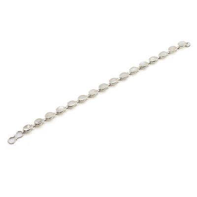 Lot 1219 - A sterling silver moonstone line bracelet