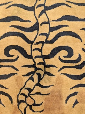 Lot 33 - A pair of wool 'tiger' rugs
