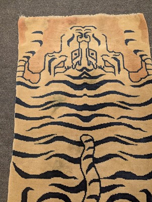 Lot 33 - A pair of wool 'tiger' rugs