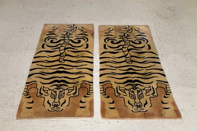 Lot 33 - A pair of wool 'tiger' rugs