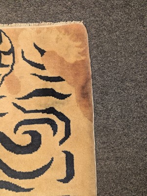 Lot 33 - A pair of wool 'tiger' rugs