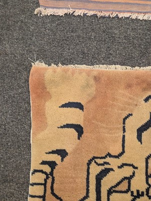 Lot 33 - A pair of wool 'tiger' rugs