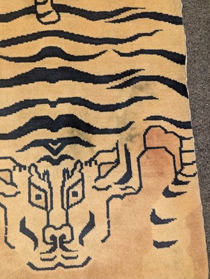 Lot 33 - A pair of wool 'tiger' rugs