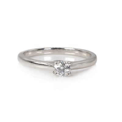 Lot 1118 - A platinum and diamond single stone ring, by The Leo