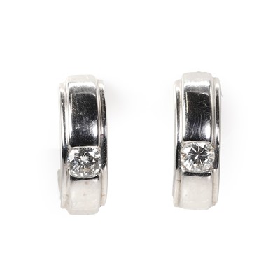 Lot 1096 - A pair of 18ct white gold diamond cuff earrings