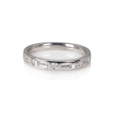 Lot 1121 - An 18ct white gold diamond half eternity ring