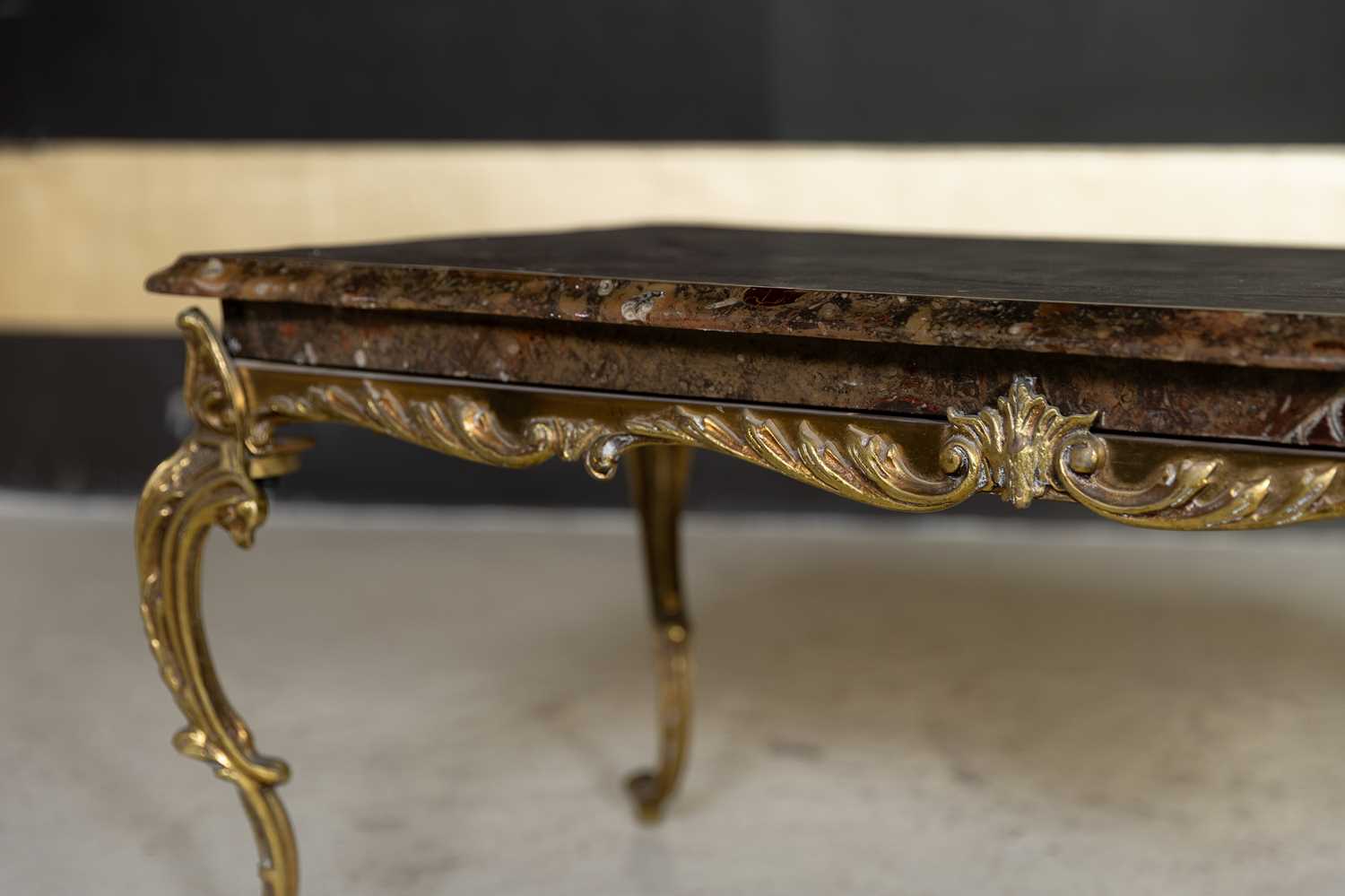 Lot 20 - A fossilised ammonite marble and gilt-brass coffee table