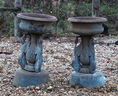 Lot 760 - A pair of cast iron garden urns