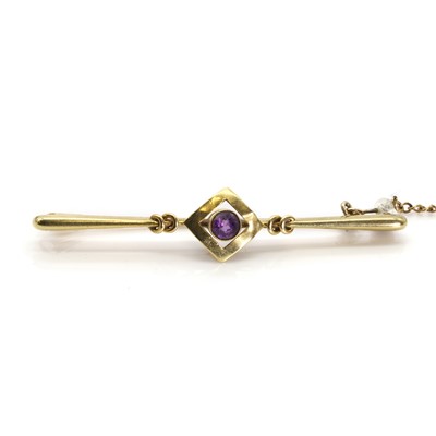 Lot 1055 - An early 20th century amethyst bar brooch