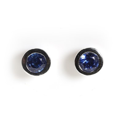 Lot 1159 - A pair of 18ct white gold sapphire stud earrings