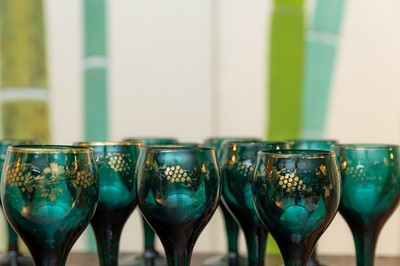 Lot 134 - A set of ten green glass goblets