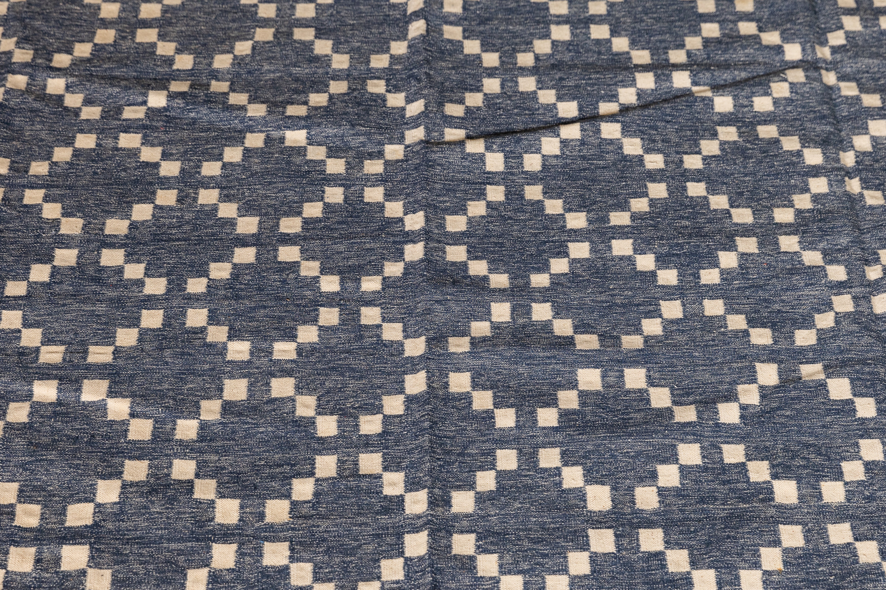 Lot 431 - A diamond pattern durrie,