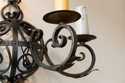 Lot 57 - A set of three wrought-iron wall lights