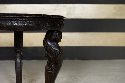 Lot 147 - A Renaissance-style golden oak and walnut guéridon