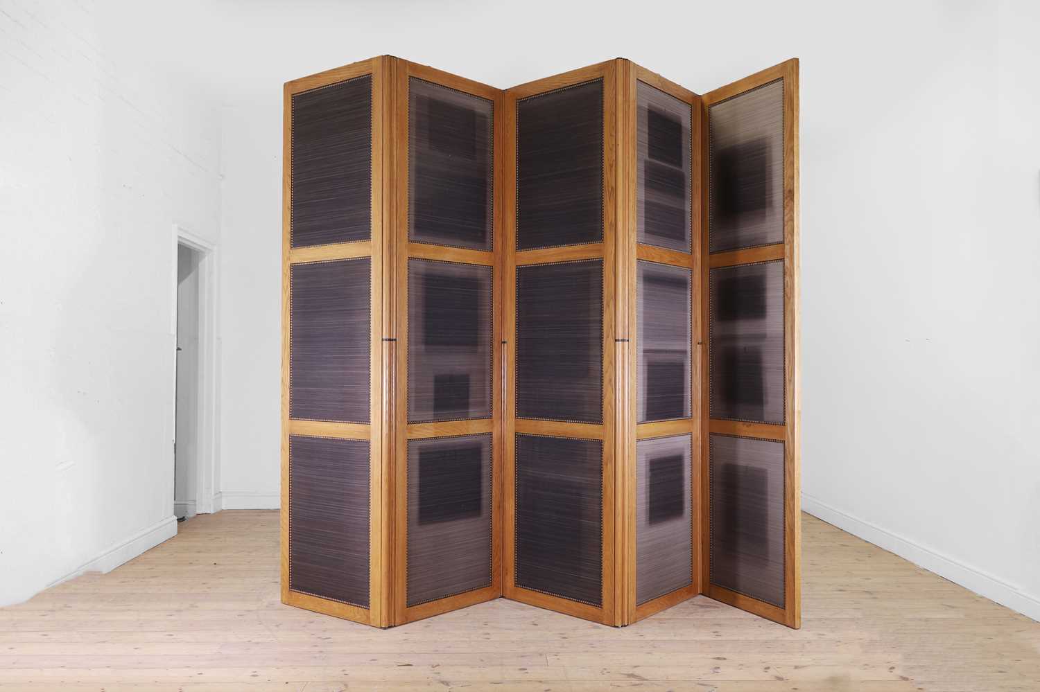 Lot 287 - A large oak five-leaf folding screen