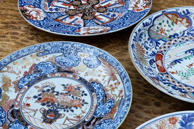 Lot 115 - A group of four Imari porcelain chargers