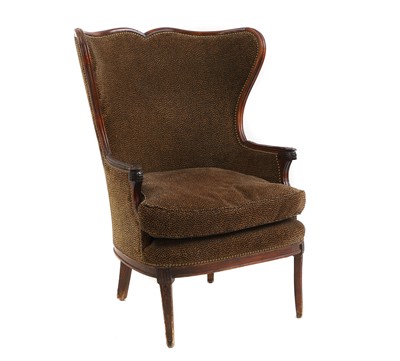 Lot 628 - A French mahogany framed wing back armchair