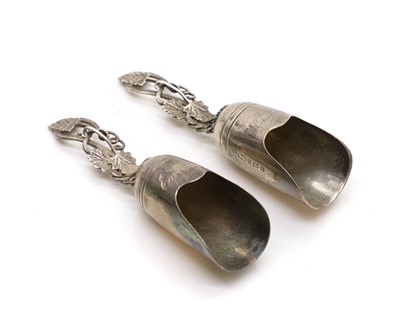 Lot 25 - A matched pair of silver caddy spoons