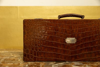 Lot 184 - A crocodile leather case