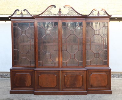 Lot 413 - A George III style mahogany breakfront bookcase