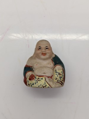 Lot 59 - A porcelain Happy Buddha