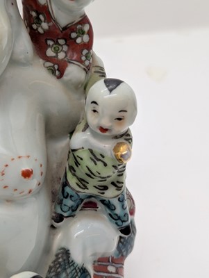 Lot 59 - A porcelain Happy Buddha