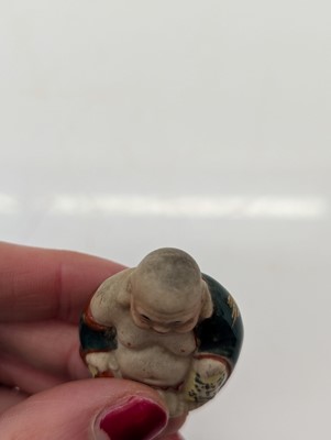 Lot 59 - A porcelain Happy Buddha