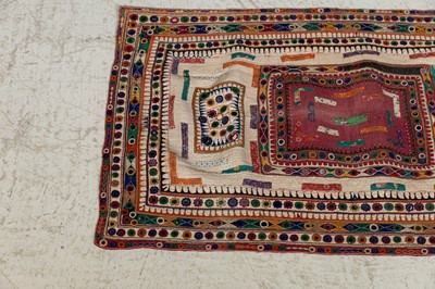 Lot 94 - An appliqué and mirrorwork baby's quilt