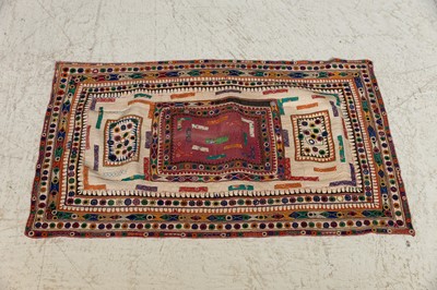 Lot 94 - An appliqué and mirrorwork baby's quilt