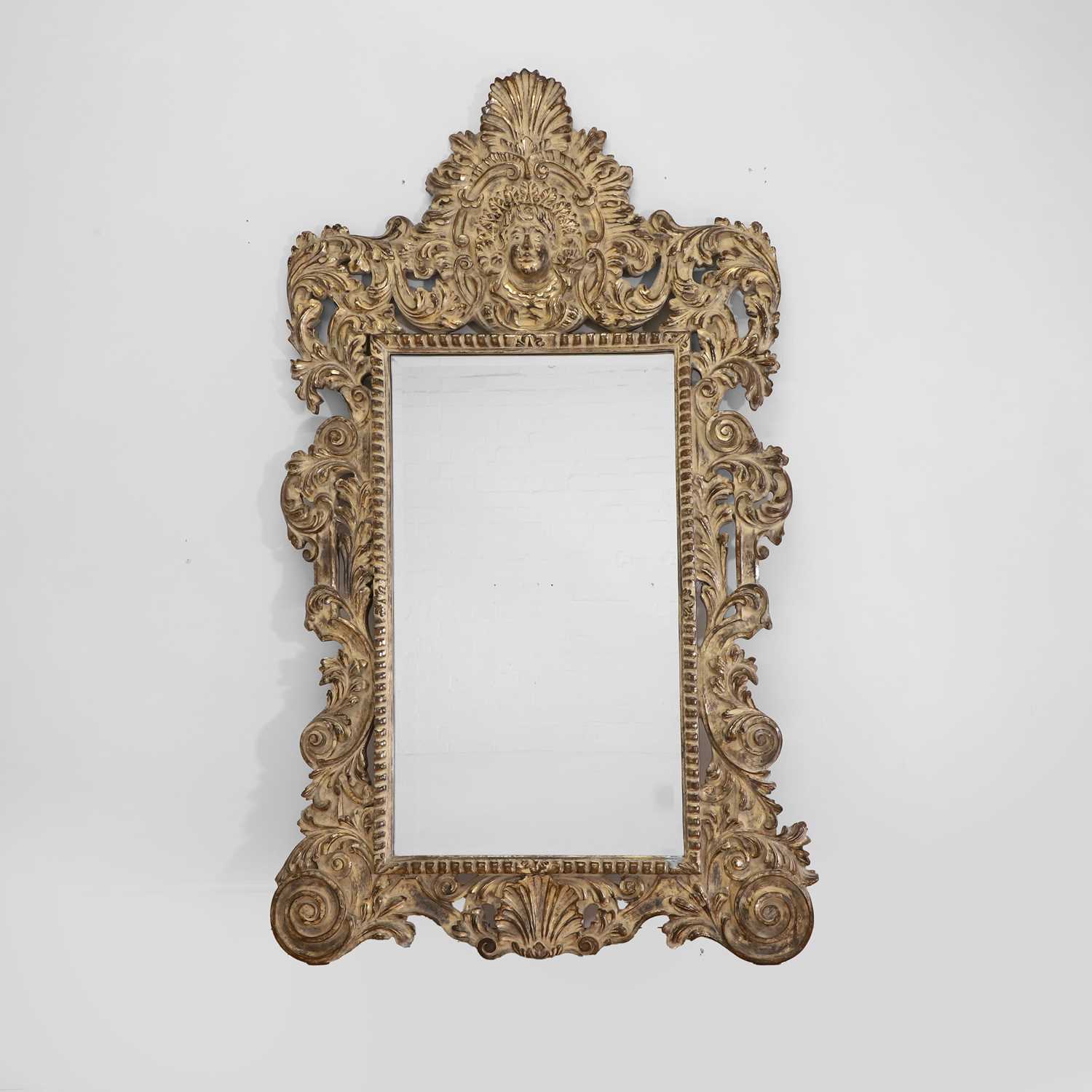 Lot 390 - A large gilt wall mirror