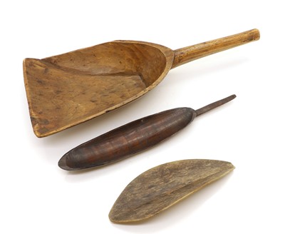 Lot 307 - A group of three African carved wood paddles