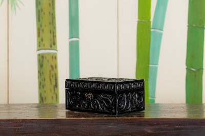 Lot 123 - A carved ebony box