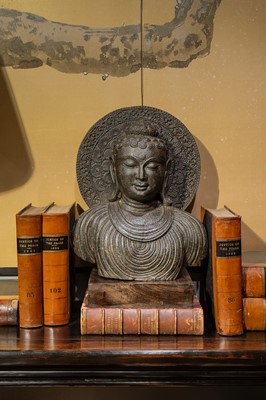 Lot 110 - A carved stone Gandhara-style Buddha