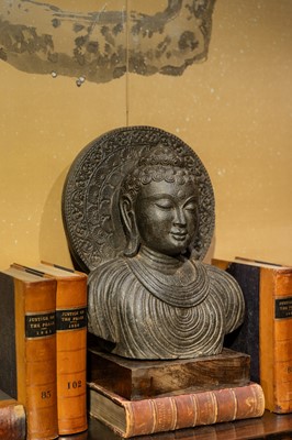 Lot 110 - A carved stone Gandhara-style Buddha