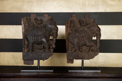 Lot 109 - A pair of carved wooden elephants