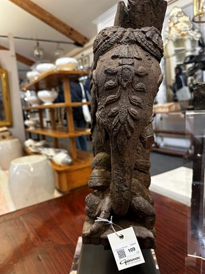Lot 109 - A pair of carved wooden elephants