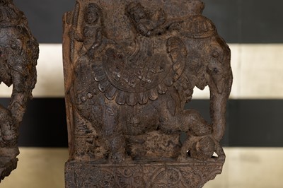 Lot 109 - A pair of carved wooden elephants